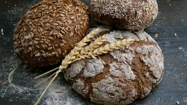 Artisan bread and baked goods on rustic wooden table